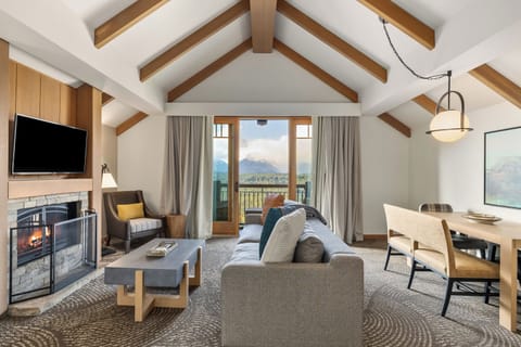 This 6th-floor Penthouse Suite offers unmatched luxury, a step-out deck with seating, and the most coveted 180° sunset mountain and river views.