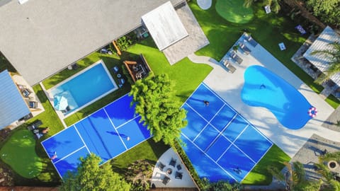 Bird's-eye view of your private backyard oasis - 2 pools, 2 pickleball courts, 2 putting greens, 2 fire pits - one unforgettable vacation