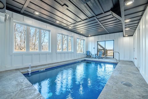 Dive into your private indoor pool oasis, where warm waters and winter views create the perfect year-round retreat.