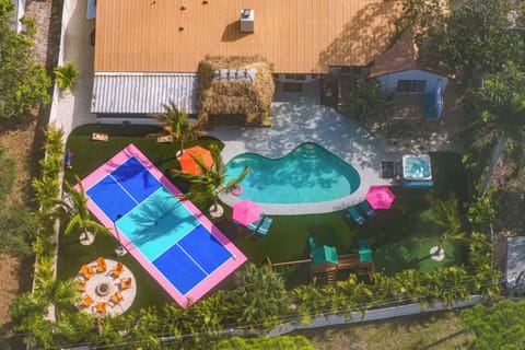Outdoor Oasis: Dive into fun with a heated pool, hot tub, and vibrant outdoor living spaces!
