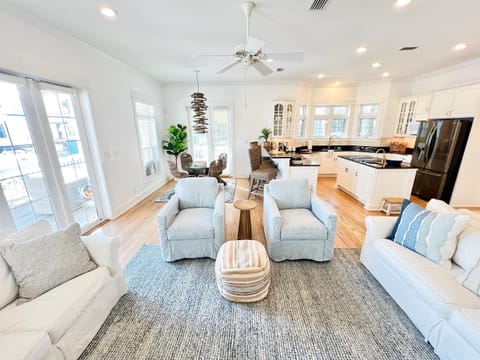 The open concept space between the kitchen, dining area, and living room encourage everyone to connect. 