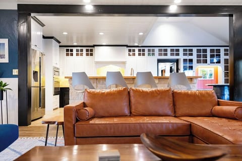 Sink into buttery leather seating while the open kitchen invites you to create memorable meals in this beautifully designed space.