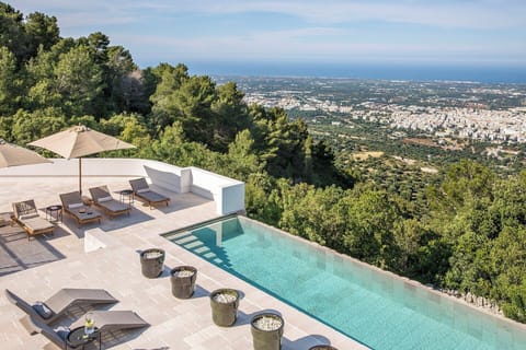 Olive groves, Fasano and the blue Adriatic Sea seen from the pool area.