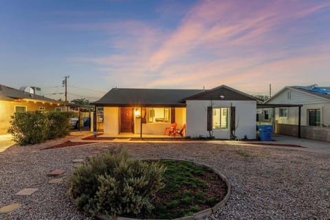 Modern home exterior with private parking and landscaped yard