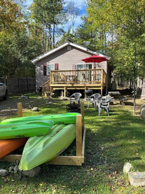 Front yard area has BBQ, fire pit area and place for kayak