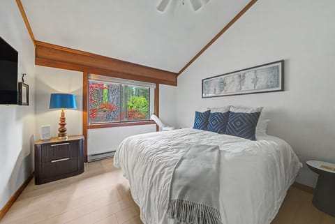 Beautifully appointed second bedroom featuring a king bed, A/C, and tasteful artwork