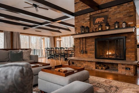 A crackling wood-burning fireplace set in a stunning brick hearth. The ultimate soundtrack to a cozy North Conway night in.