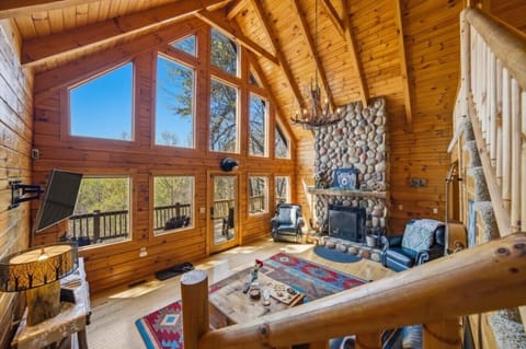 Living Room | Stone Fireplace & Lofted Ceilings