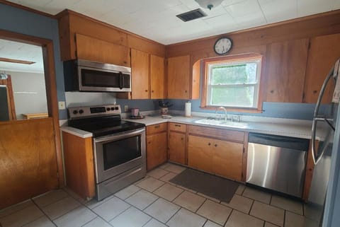 Kitchen | Wood Cabinets & Stainless Appliances