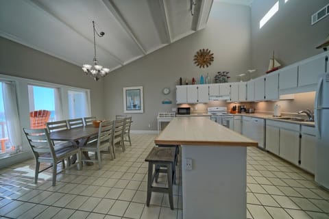 Gather in a culinary space designed for connection, where every meal is accompanied by the soothing presence of the ocean.