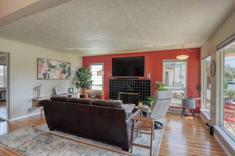 Classic mid-century look with a modern touch. Large Smart TV with soundbar, woofer and surround sound.