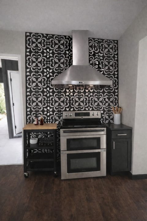 Stove with electronic microwave drawer. Cart for patio or hot tub entertainment.