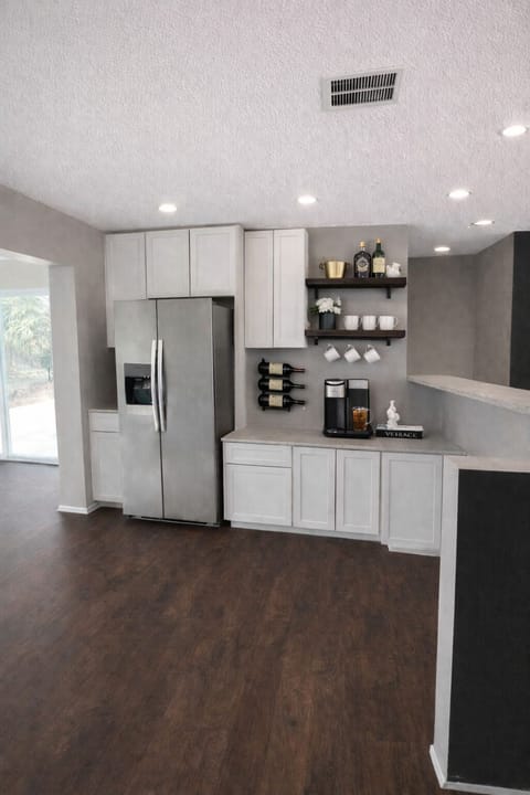 Fully stocked kitchen with wine & coffee bar.