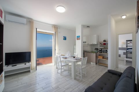 Apartment, Sea View | Living area | Smart TV