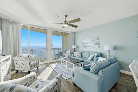 Relax in this modern living room with ocean views and natural light.