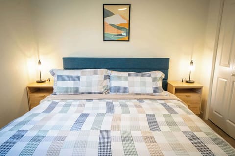 Luxurious king-size bed in cozy bedroom