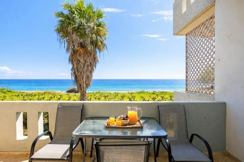 Private Balcony with Sea View and Outdoor Dining Setup