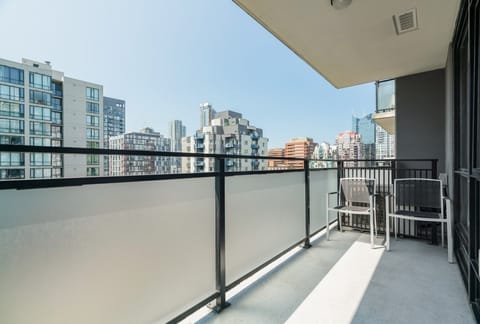 Step onto the spacious balcony, which provides a perfect retreat for enjoying your morning coffee while soaking in the vibrant cityscape.