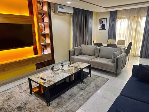 Presidential Suite, Patio, City View | Living area | TV