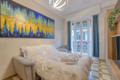 Luxury Quadruple Room, City View | In-room safe, desk, laptop workspace, blackout drapes