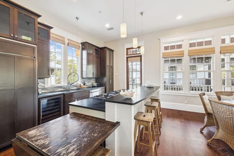 Your gourmet kitchen awaits with granite counters, stainless appliances, and a breakfast bar perfect for morning coffee or evening wine.