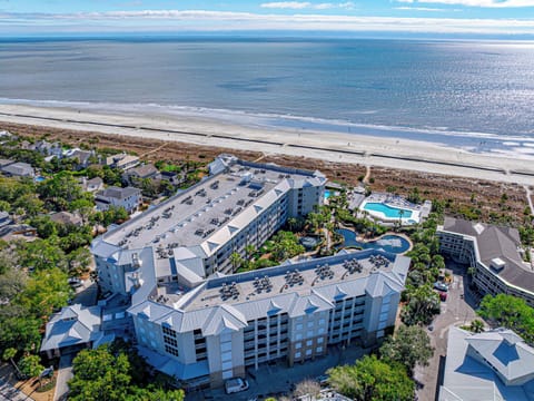 Bird’s-eye view of the home and shoreline.