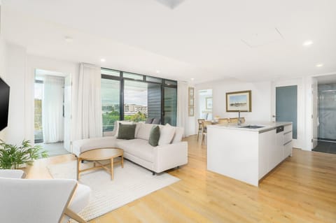 Entire living and kitchen area bathed in natural light, creating a welcoming home-from-home vibe.