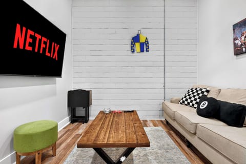 Living room: Compact living room with a comfortable sofa and entertainment-ready TV.