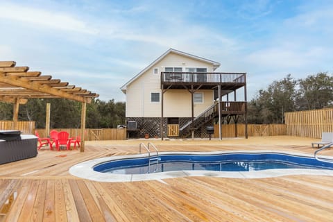 Backyard - games being added - chairs, and shade. New Deck, Pool and Hot Tub