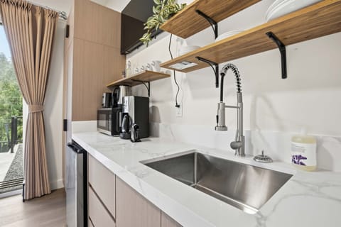 Full size sink and kitchen.