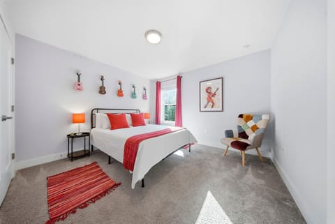 Bedroom 3 with queen bed and airy windows