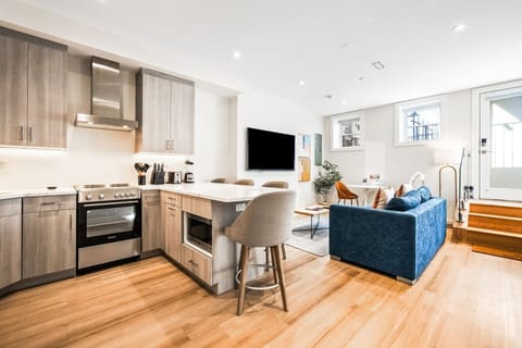 All essentials are within easy reach, featuring a kitchen, living room, and dining area.