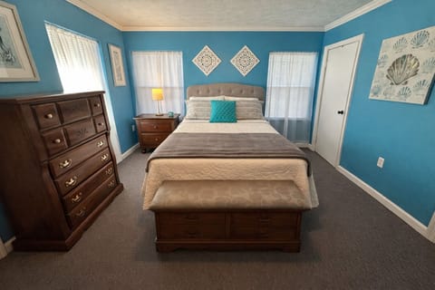 Cozy full‑bed room tucked behind a private hallway.