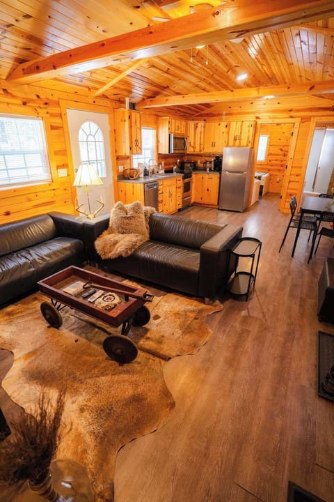 Living Room: Discover the warmth of wood accents and modern comforts in this inviting space!