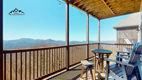 Sip your morning coffee while taking in breathtaking mountain vistas from your private covered deck with comfortable seating.