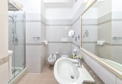 Combined shower/tub, hair dryer, bathrobes, slippers