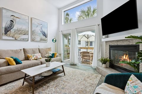 The living room has a vaulted ceiling providing a open feeling to it.