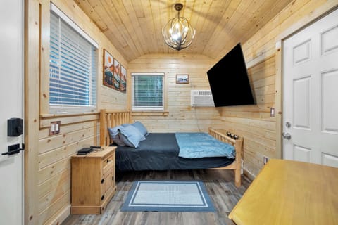 Cozy sleeping nook with warm wood accents