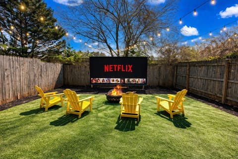 Private year-round outdoor retreat features a 150" cinema, fire pit and games
