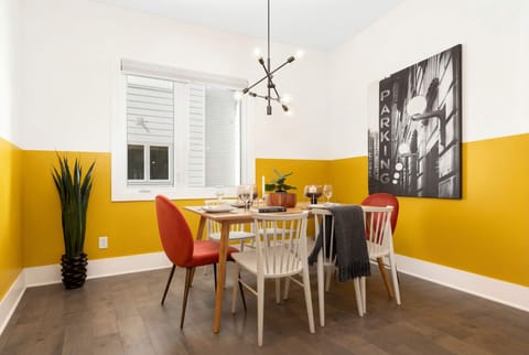 Pendant-lit dining table seats the whole crew for group meals and board games on nights when staying in sounds better than heading downtown