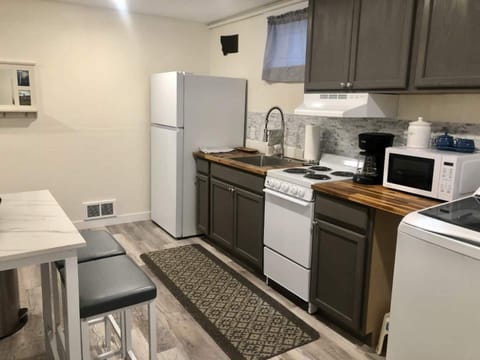  Small apartment-size kitchen perfect for quick meals.