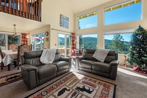 Living Room - Large spacious Living Room with high ceilings and large windows that feature an amazing view! Comfy couches and Smart TV!