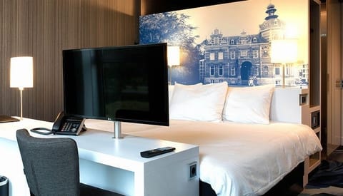 Kick back in bed and enjoy in-room entertainment and comfort.