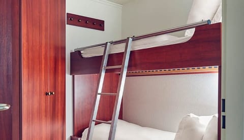 Tuck in comfortably with a space-saving bunk bed setup.
