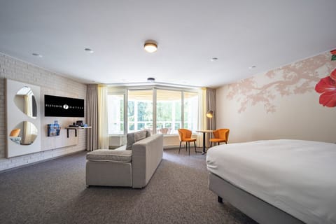 Stretch out in an airy suite with lounge seating and views.