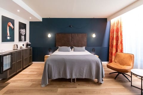 Unwind in a boutique-style room with warm designer lighting.