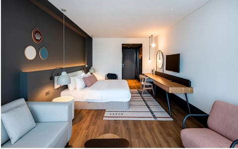 Stretch out in a spacious room with lounge seating and desk.