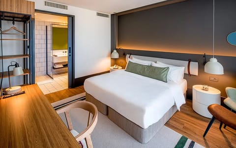 Wake refreshed in a stylish room with warm ambient lighting.