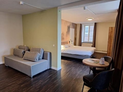 Settle into the spacious studio with lounge seating and comfort.