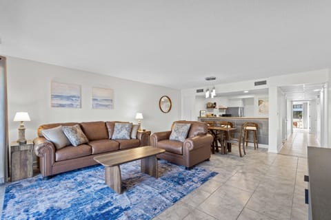 The sofa is a queen sleeper sofa. The white chest in the living room contains linens for this extra bed. 